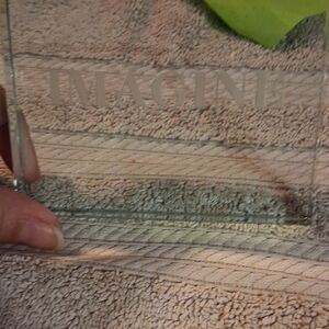 Glass Art Decor with 'IMAGINE' Inscription